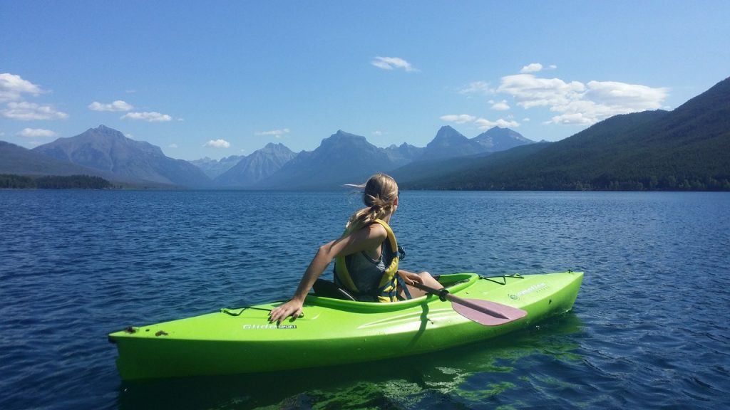 Woman paddling a recreational kayak